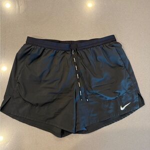 5 inch Nike Dri-FIT black running shorts.